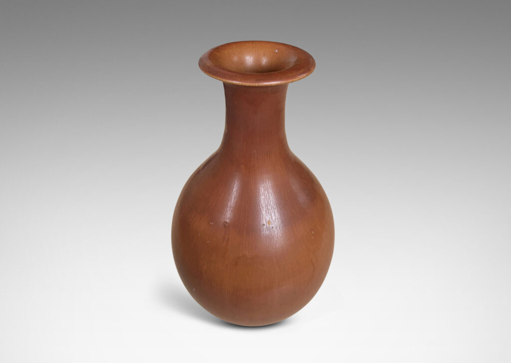 Gallery BAC swelling form with sprouting neck and flared lip, glazed in soft brown tones
