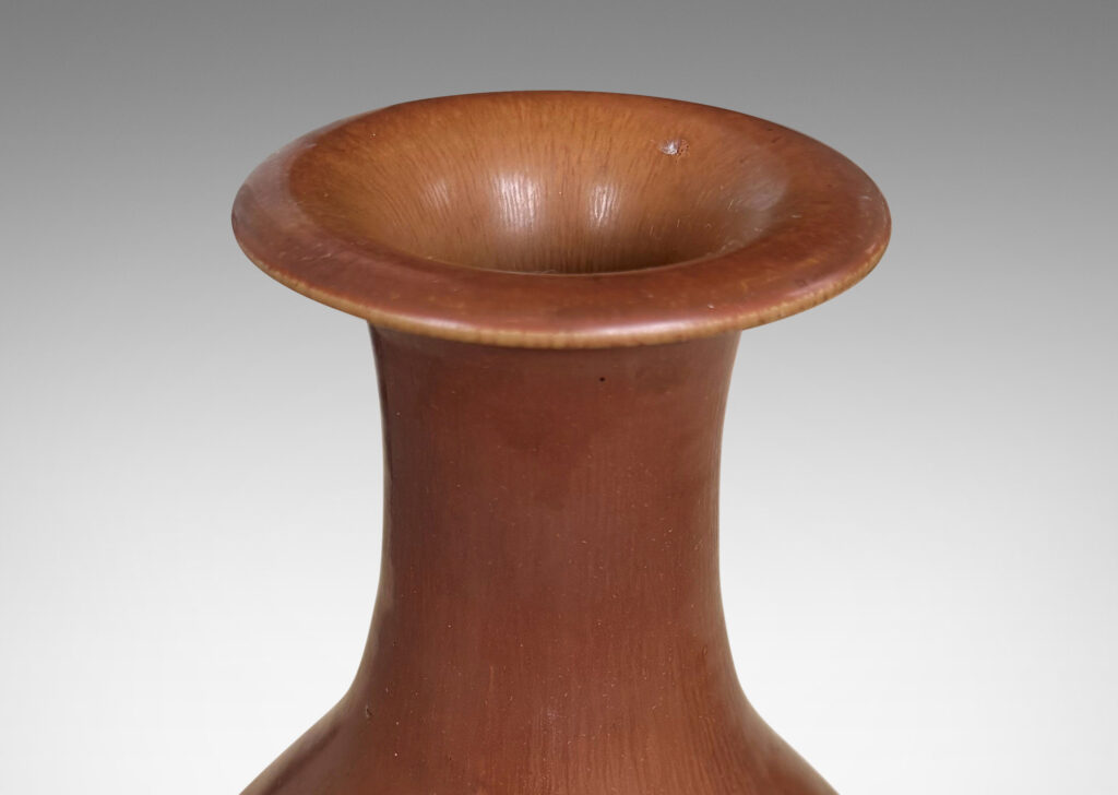 Gallery BAC swelling form with sprouting neck and flared lip, glazed in soft brown tones