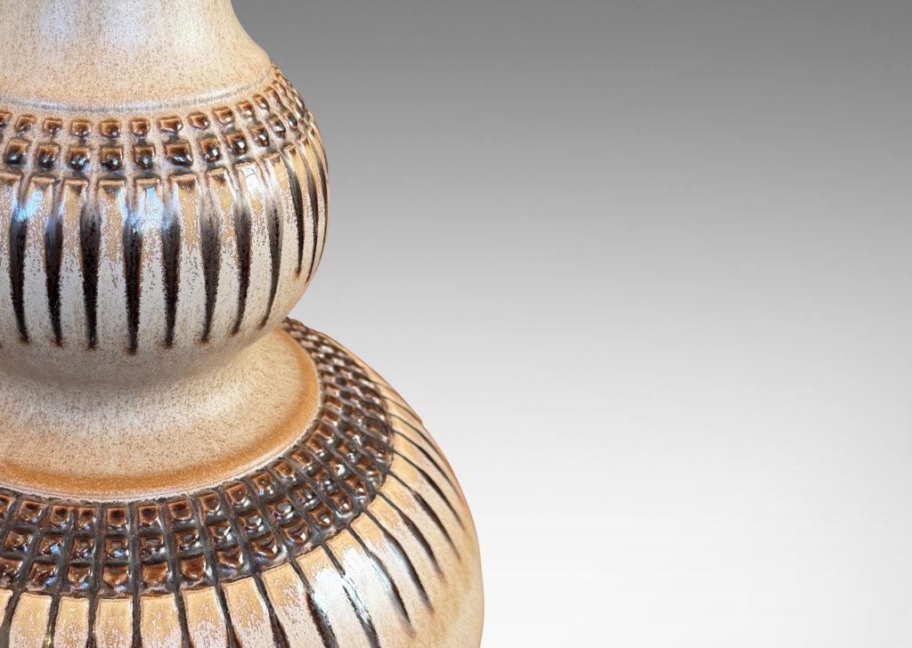 Gallery BAC double gourd form punctuated with basket-like geometric ornaments in relief, glazed in tan and brown