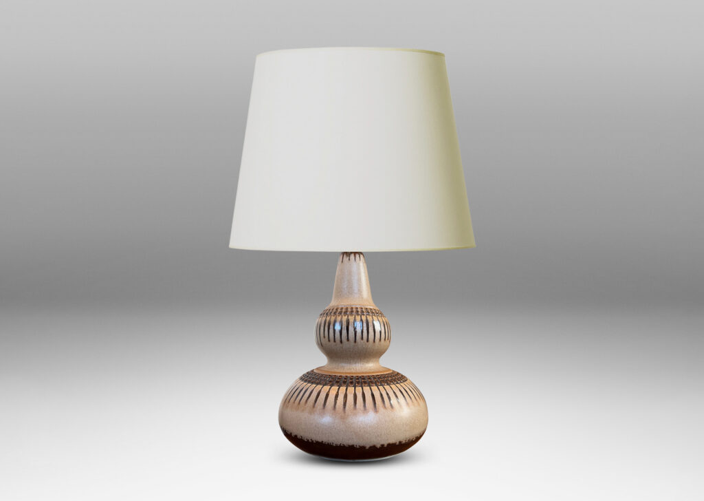 Gallery BAC double gourd form punctuated with basket-like geometric ornaments in relief, glazed in tan and brown