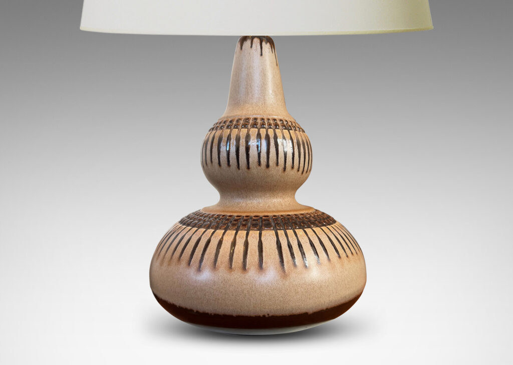 Gallery BAC double gourd form punctuated with basket-like geometric ornaments in relief, glazed in tan and brown