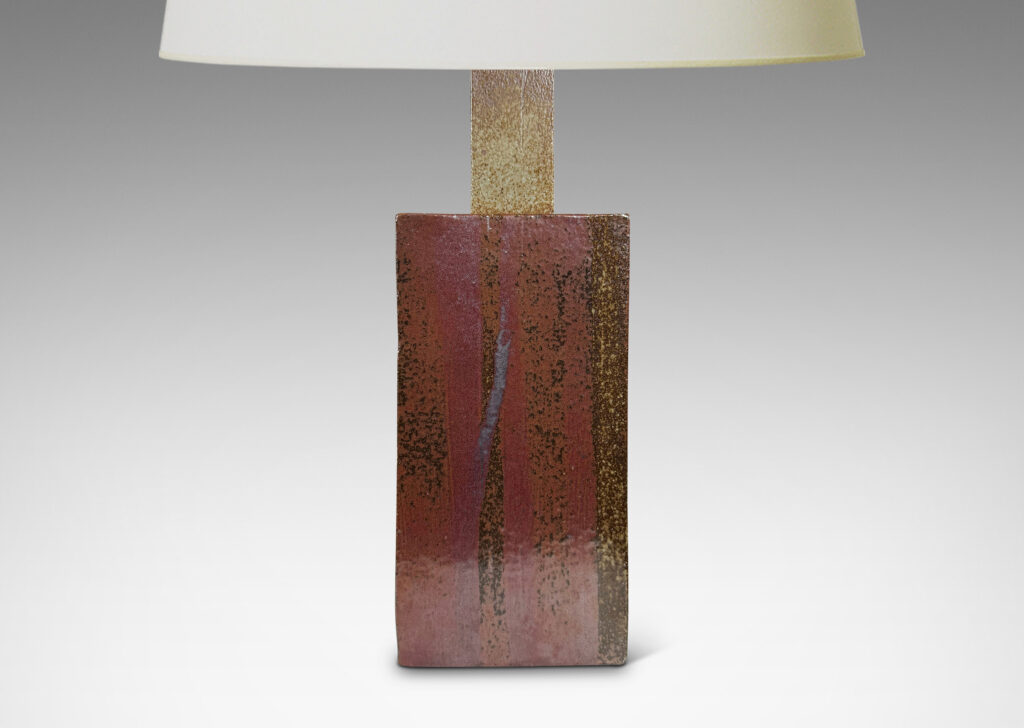 Gallery BAC two floating rectangular planes connected by a central pillar, glazed in dappled gray and red-brown