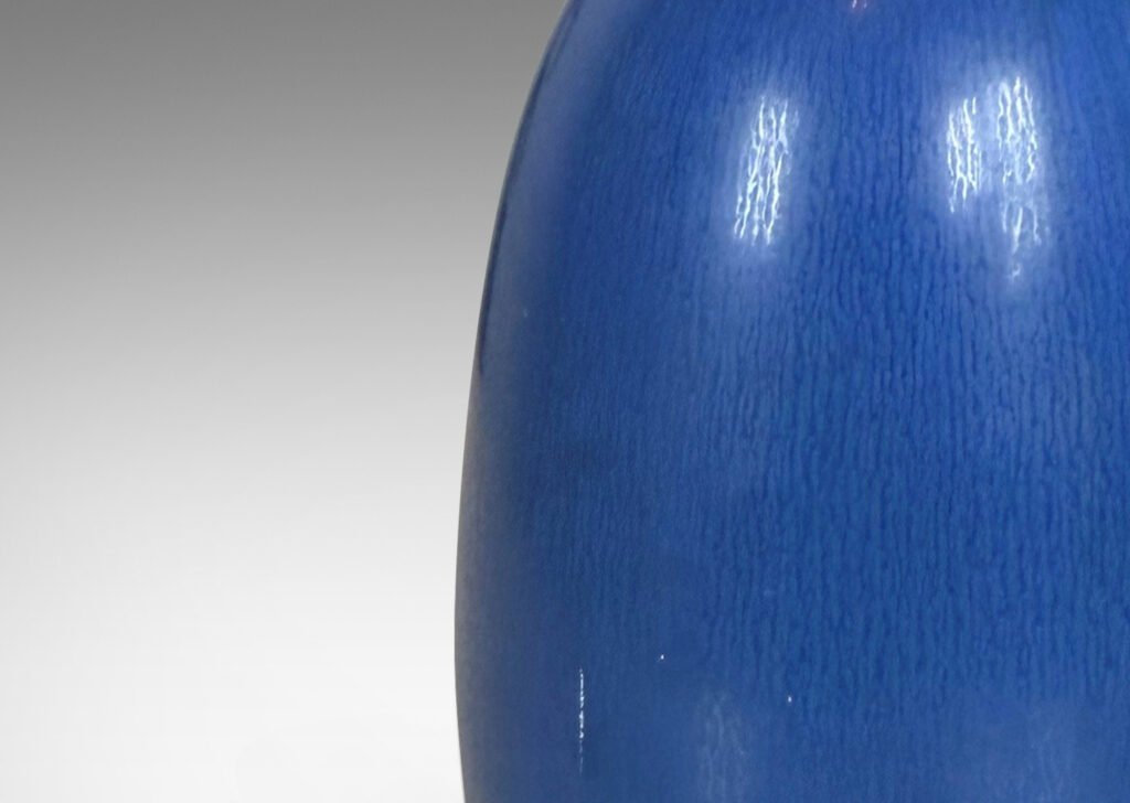 Gallery BAC bulbous form with attenuated neck, glazed in a deep cornflower blue