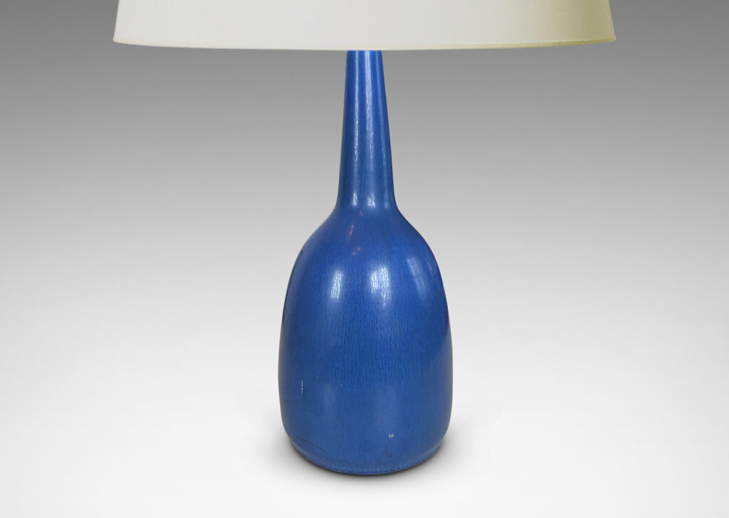 Gallery BAC bulbous form with attenuated neck, glazed in a deep cornflower blue