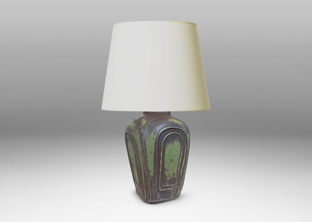 Gallery BAC four arched sides with squinched shoulders and a bottle mouth, glazed in eggshell jungle green and brown