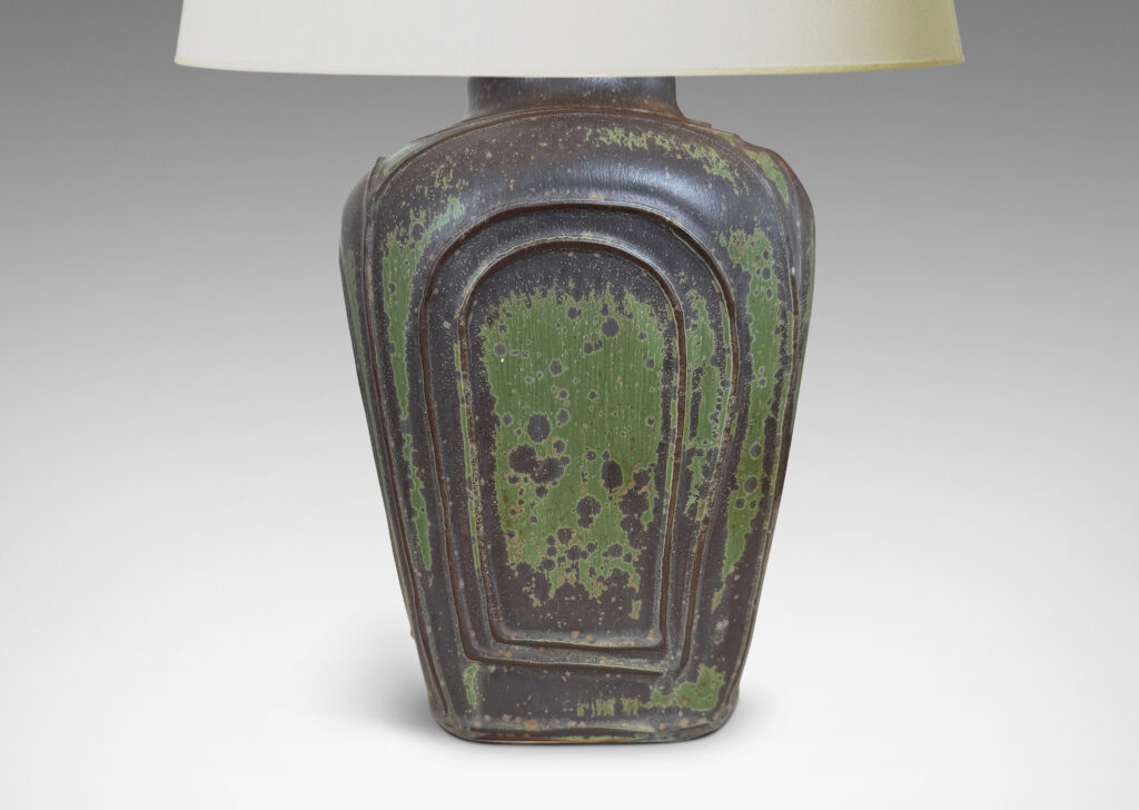 Gallery BAC four arched sides with squinched shoulders and a bottle mouth, glazed in eggshell jungle green and brown