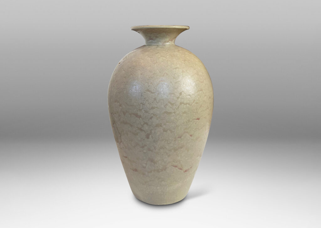 Gallery BAC tall tapered form and flared mouth, glazed in a dappled pale taupe and light beige