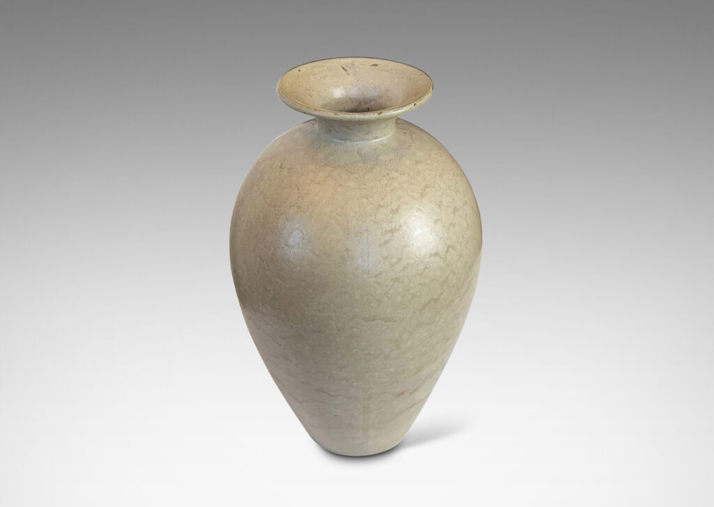 Gallery BAC tall tapered form and flared mouth, glazed in a dappled pale taupe and light beige