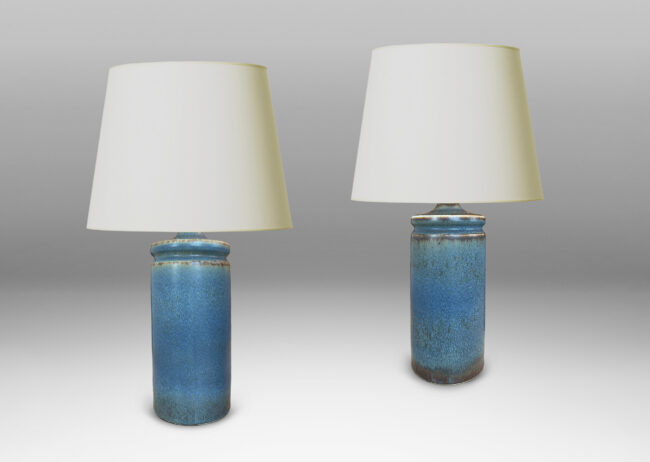 Gallery BAC cylindrical forms with exotic capped top, glazed in a soft blue with brown
