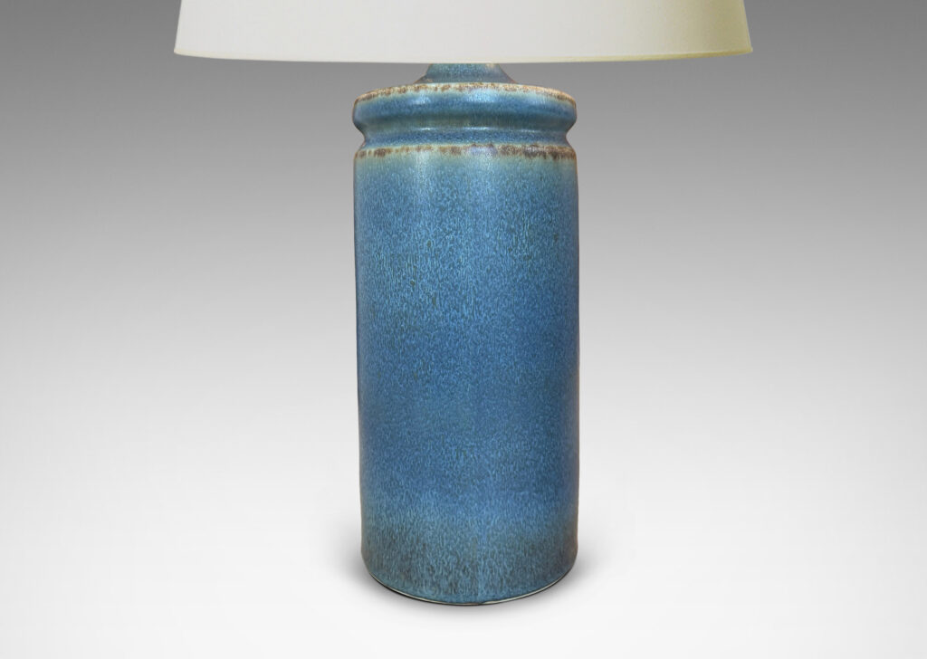 Gallery BAC cylindrical forms with exotic capped top, glazed in a soft blue with brown