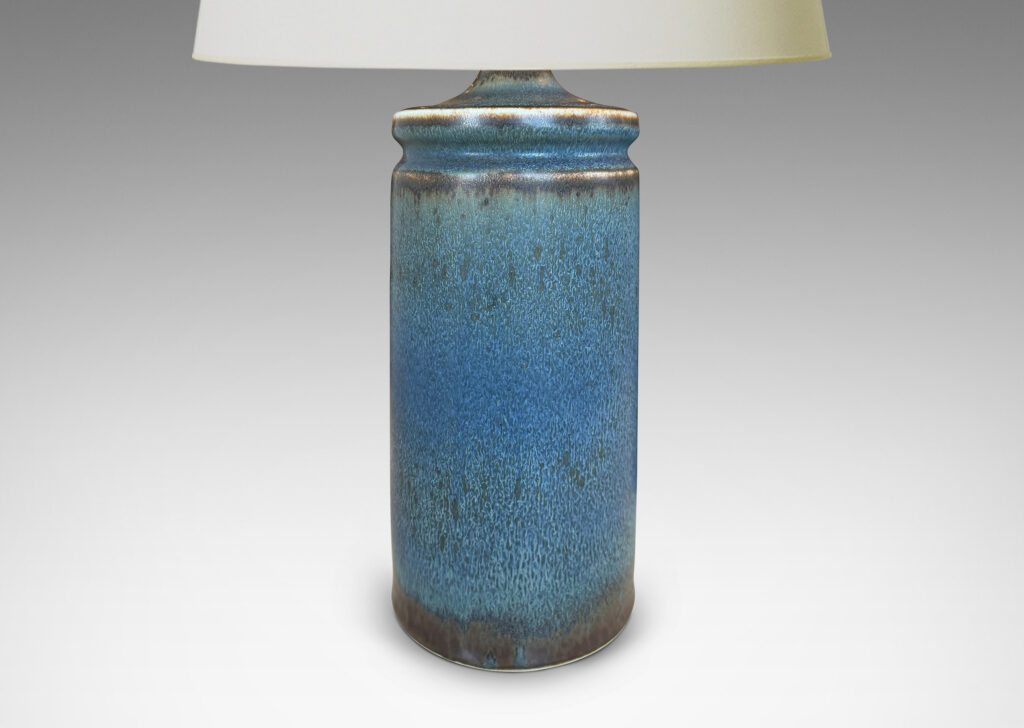 Gallery BAC cylindrical forms with exotic capped top, glazed in a soft blue with brown