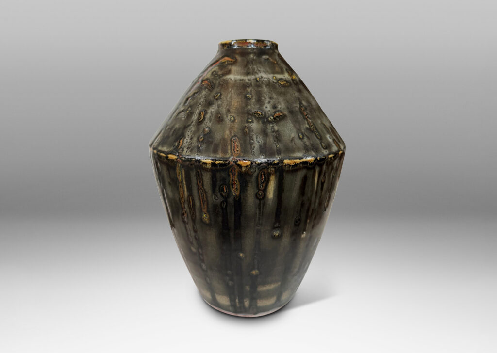 Gallery BAC angled form glazed in a thick flowing charcoal-black