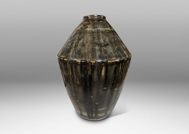 Gallery BAC angled form glazed in a thick flowing charcoal-black