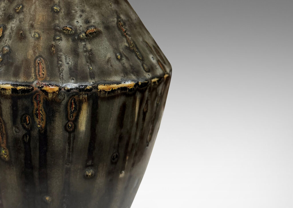 Gallery BAC angled form glazed in a thick flowing charcoal-black