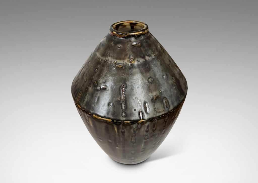 Gallery BAC angled form glazed in a thick flowing charcoal-black
