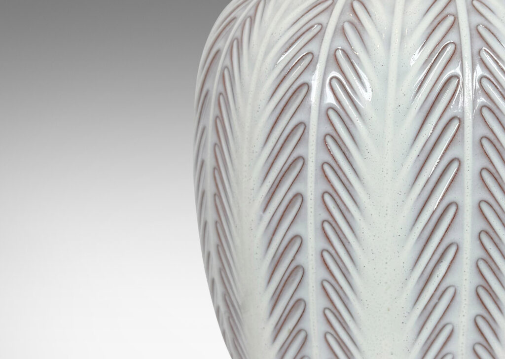 Gallery BAC ovoid form with carved foliate-like meridians, glazed in glossy white