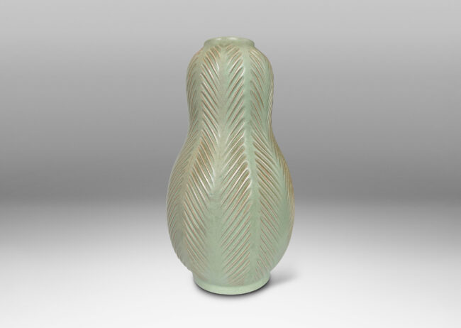 Gallery BAC double gourd form, with carved herringbone stripes, glazed in a matte subtle celadon green