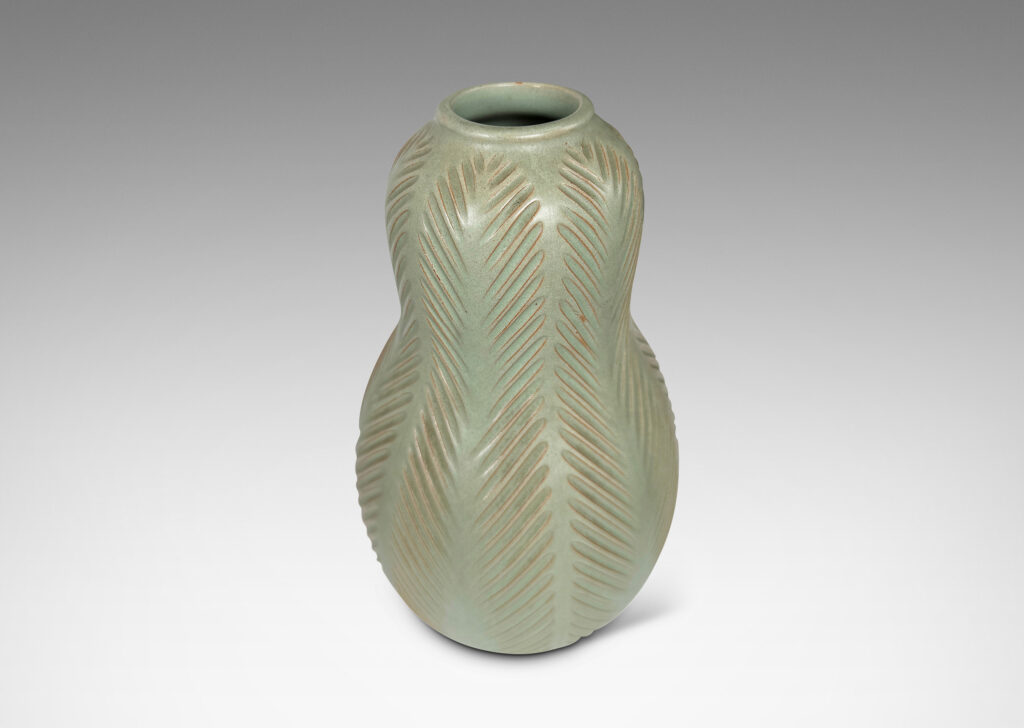 Gallery BAC double gourd form, with carved herringbone stripes, glazed in a matte subtle celadon green