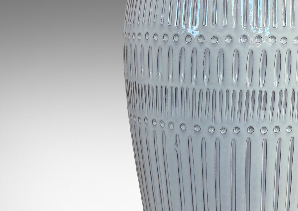 Gallery BAC classic tall tapering form with flared mouth and carved geometric ornaments