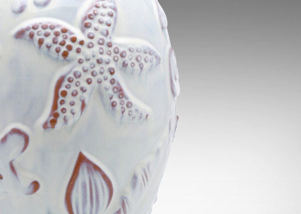 Gallery BAC ovoid form with reliefs depicting marine flora and fauna glazed in a shiny white