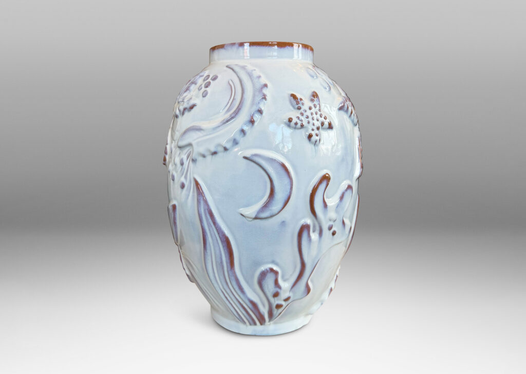 Gallery BAC ovoid form with reliefs depicting marine flora and fauna glazed in a shiny white