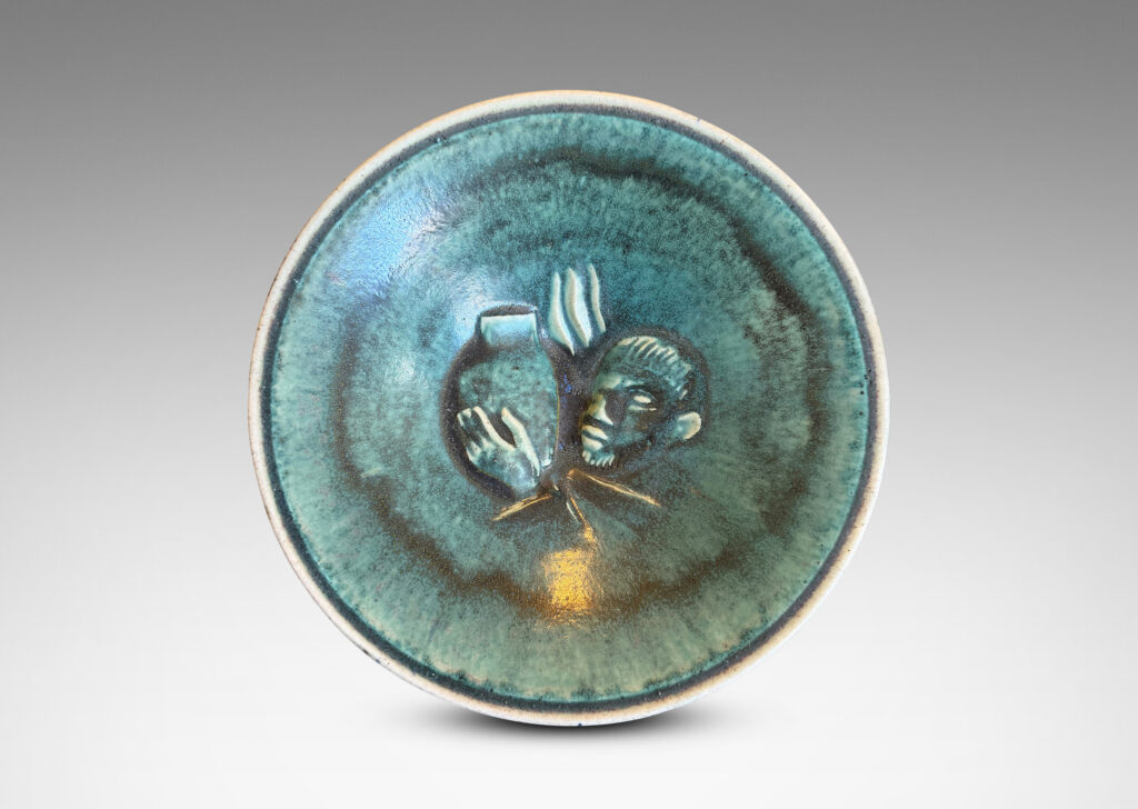Gallery BAC angled form on a short stand, with central internal relief of a man with libations