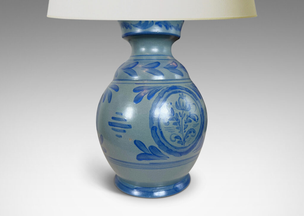 Gallery BAC plump baluster form glazed in light blue, with hand-painted blue foliate ornaments