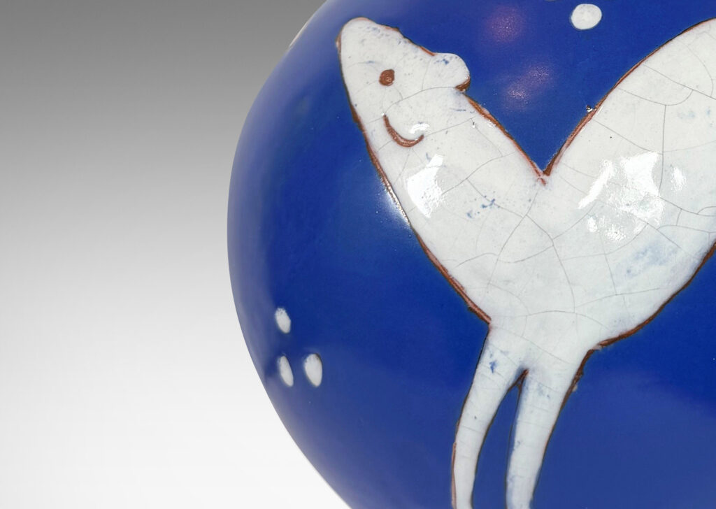 Gallery BAC globe form with cuff neck, glazed ultramarine blue with white animal figures and geometrics