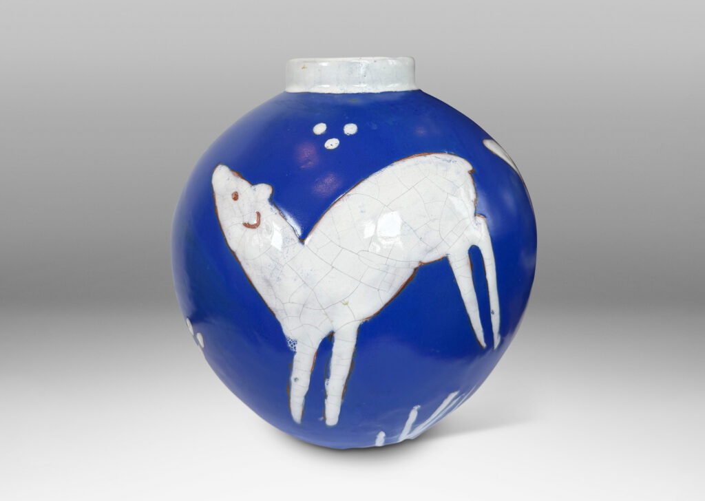 Gallery BAC globe form with cuff neck, glazed ultramarine blue with white animal figures and geometrics